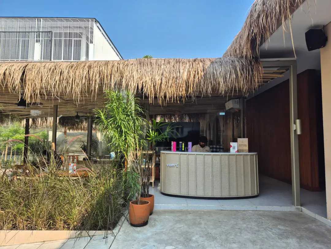 Thatched coffee bar with planting