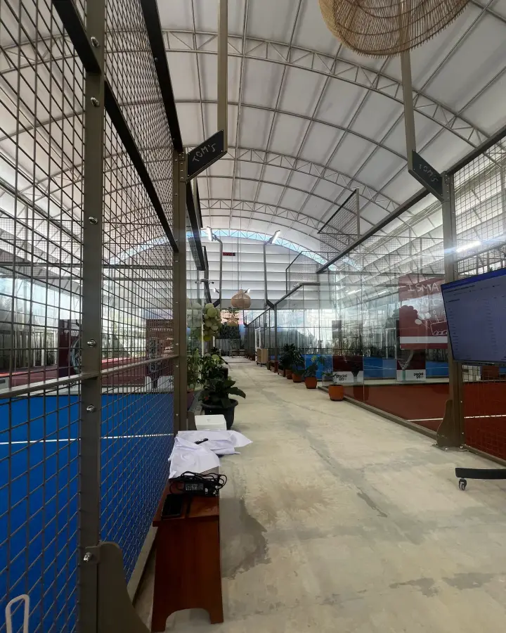 Walkway between courts under the arched roof